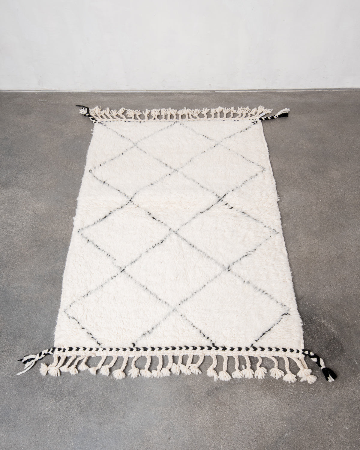 Modern, designer, handcrafted Berber rug from Morocco. Beniourain carpet with beautiful colours and patterns and fluffy wool texture.